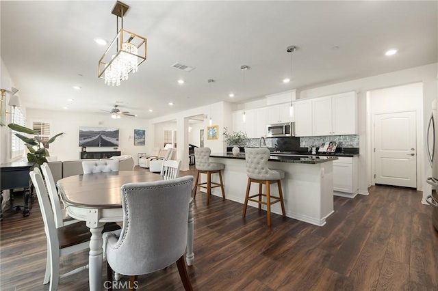29273 Caravel Dr, Menifee, CA 92585 - dining area featuring ceiling fan, recessed lighting, and dark wood finished floors