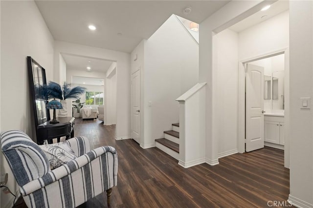 29273 Caravel Dr, Menifee, CA 92585 - hall with dark wood-style flooring, stairs, and recessed lighting