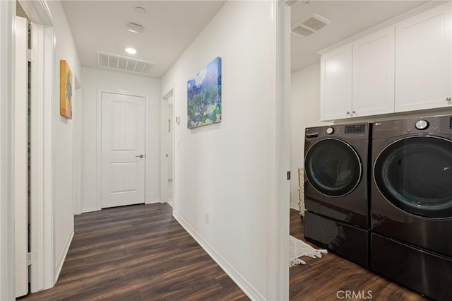 29273 Caravel Dr, Menifee, CA 92585 - laundry area featuring washer and dryer, dark wood-style floors, and cabinet space