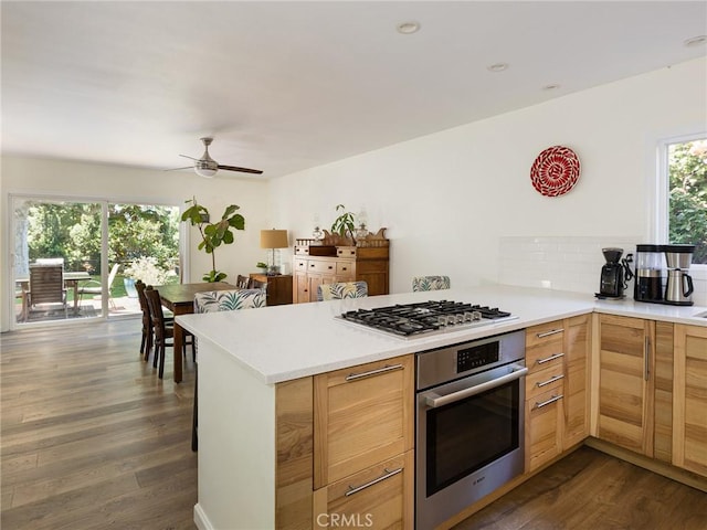 2049 Avenida Aprenda, Rancho Palos Verdes, CA 90275 - kitchen featuring stainless steel appliances, a peninsula, dark wood-type flooring, light countertops, and ceiling fan