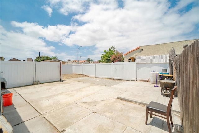 1335 W Burnett St, Long Beach, CA 90810 - fenced backyard featuring a patio area and a gate