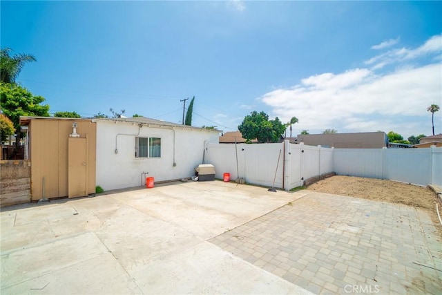 1335 W Burnett St, Long Beach, CA 90810 - rear view of house with a patio area, a fenced backyard, stucco siding, and a gate