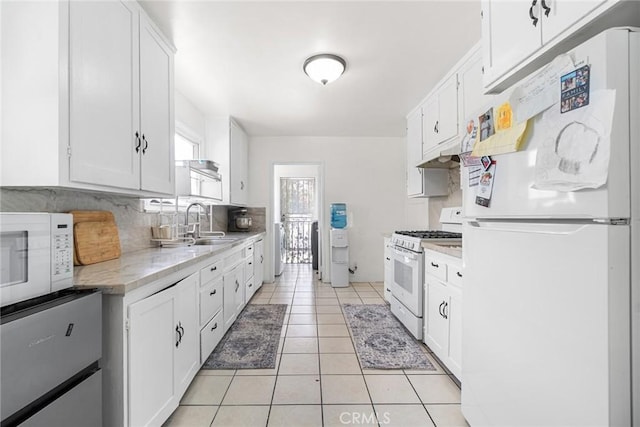 1335 W Burnett St, Long Beach, CA 90810 - kitchen with white appliances, light countertops, and white cabinets