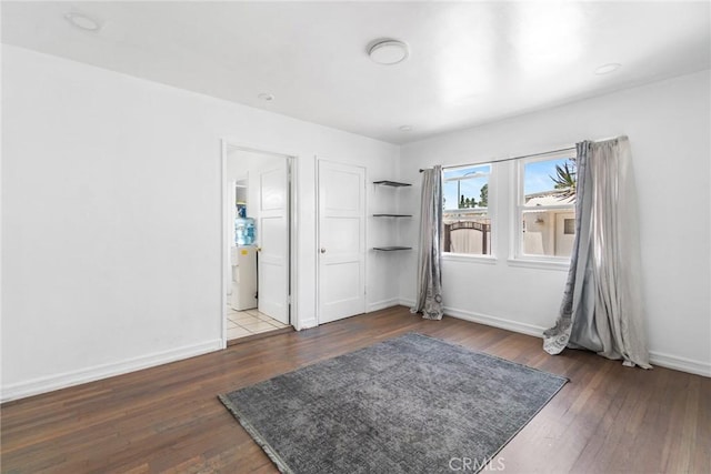 1335 W Burnett St, Long Beach, CA 90810 - unfurnished bedroom with wood finished floors and baseboards