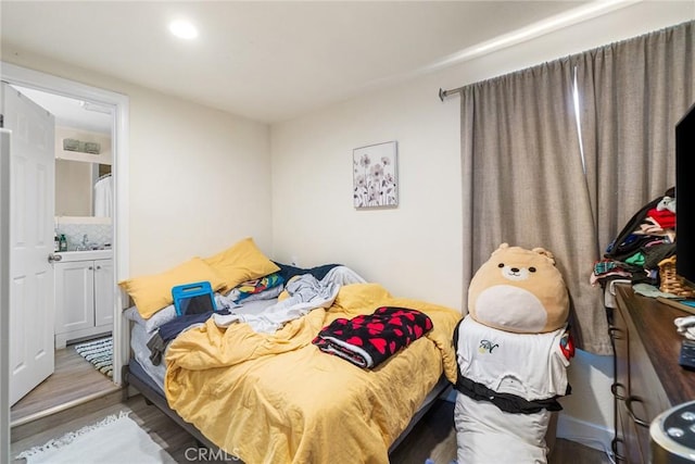 1335 W Burnett St, Long Beach, CA 90810 - bedroom with wood finished floors, connected bathroom, and recessed lighting