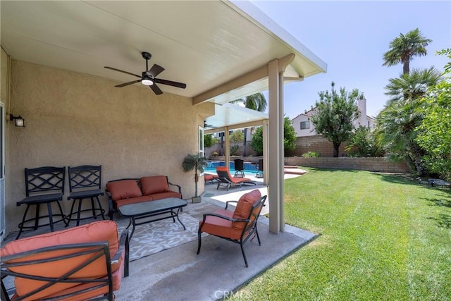 2578 Bryce Ct, Colton, CA 92324 - fenced backyard with ceiling fan, an outdoor hangout area, and a patio