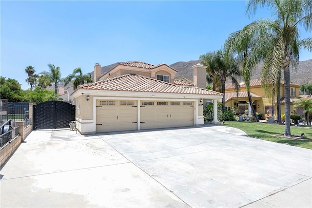 2578 Bryce Ct, Colton, CA 92324 - mediterranean / spanish home with stucco siding, driveway, a tile roof, a garage, and a chimney