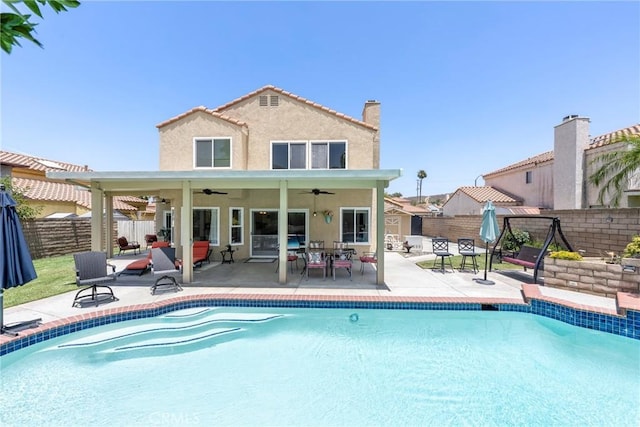 2578 Bryce Ct, Colton, CA 92324 - rear view of house featuring ceiling fan, a fenced backyard, stucco siding, and a patio area