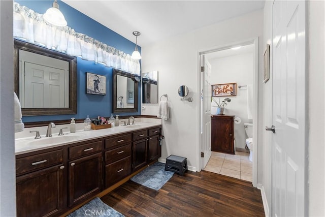 44125 Dusty Rd, Lancaster, CA 93536 - full bathroom featuring double vanity and wood finished floors
