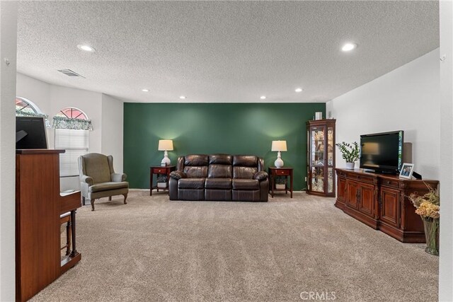 44125 Dusty Rd, Lancaster, CA 93536 - living room with carpet flooring, recessed lighting, and a textured ceiling
