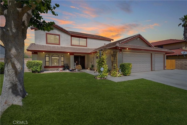 44125 Dusty Rd, Lancaster, CA 93536 - view of front facade with an attached garage, driveway, stucco siding, and covered porch