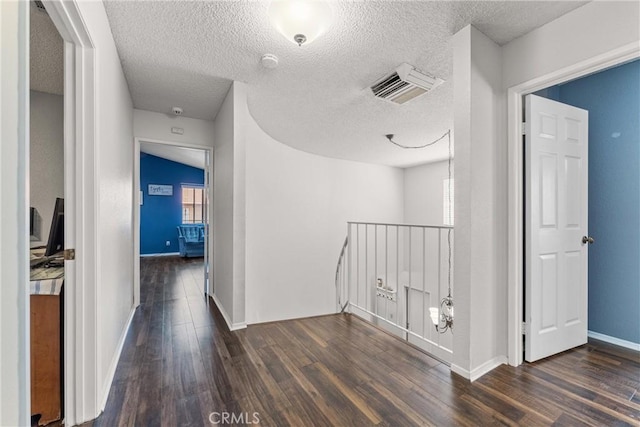 44125 Dusty Rd, Lancaster, CA 93536 - hall featuring wood finished floors, an upstairs landing, and a textured ceiling