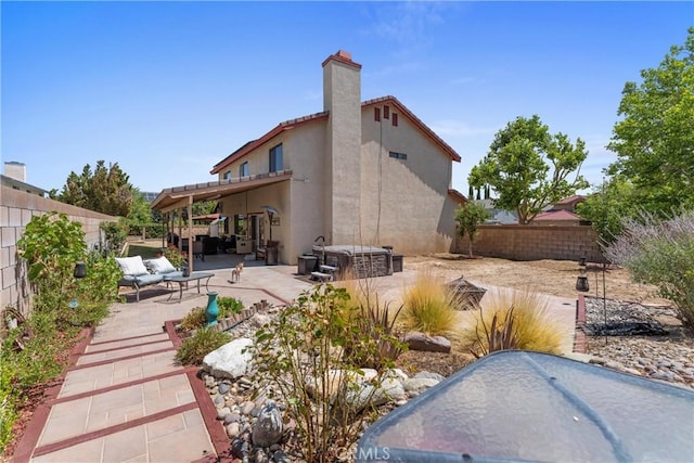 44125 Dusty Rd, Lancaster, CA 93536 - back of property with a patio area, a fenced backyard, stucco siding, outdoor lounge area, and a chimney