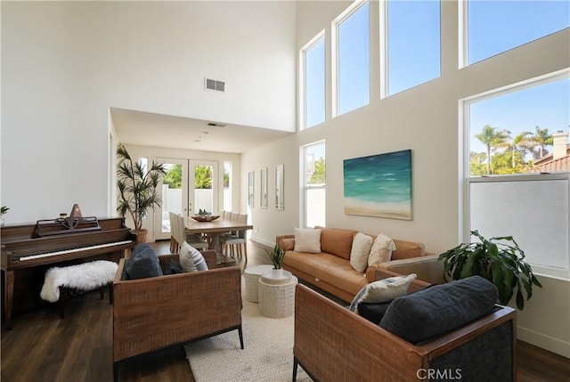 705 El Berro, San Clemente, CA 92672 - living area with dark wood-style flooring, a high ceiling, and french doors
