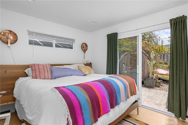 733 Lilac Dr, Los Osos, CA 93402 - bedroom with wood finished floors and access to exterior