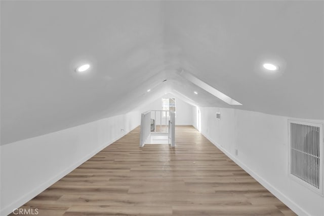 2697 Merced St, Los Angeles, CA 90065 - bonus room with a skylight, lofted ceiling, light wood-style flooring, and recessed lighting