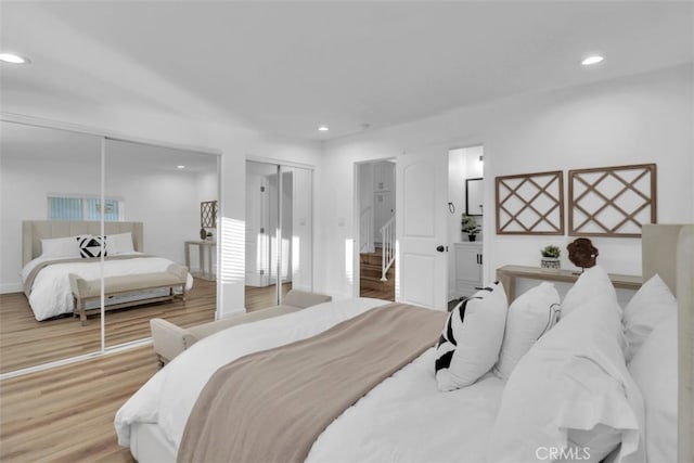 2697 Merced St, Los Angeles, CA 90065 - bedroom with recessed lighting, wood finished floors, and multiple closets