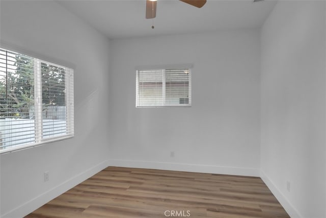 2697 Merced St, Los Angeles, CA 90065 - empty room with healthy amount of natural light, ceiling fan, and wood finished floors