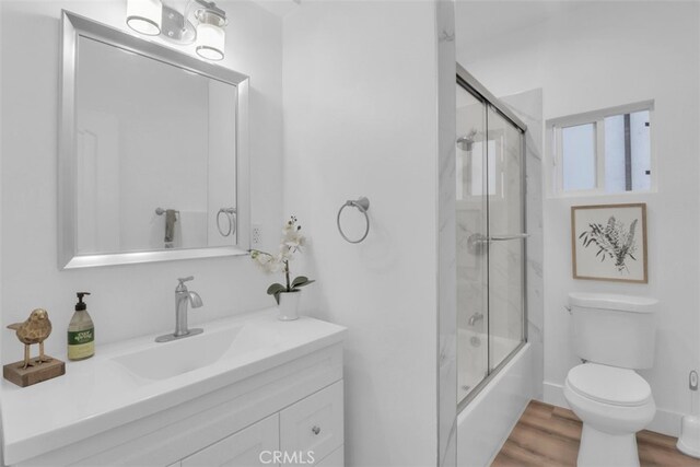 2697 Merced St, Los Angeles, CA 90065 - full bath featuring vanity, shower / bath combination with glass door, and wood finished floors