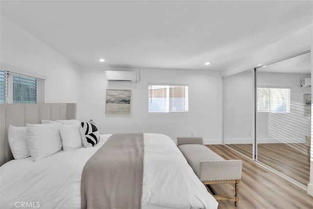 2697 Merced St, Los Angeles, CA 90065 - bedroom featuring a wall mounted air conditioner, wood finished floors, and recessed lighting