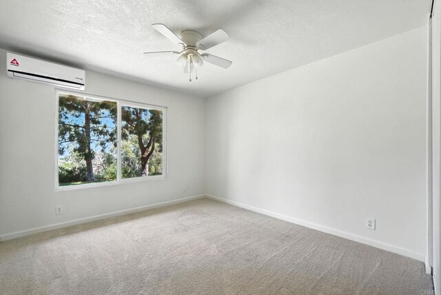575 Otay Lakes Rd Unit 26, Chula Vista, CA 91913 - unfurnished room with an AC wall unit, a ceiling fan, carpet floors, and a textured ceiling