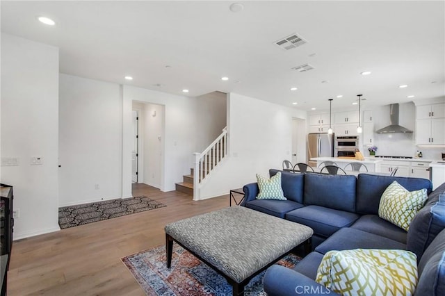 783 Longhorn, Rancho Mission Viejo, CA 92694 - living area with light wood-type flooring, recessed lighting, and stairway