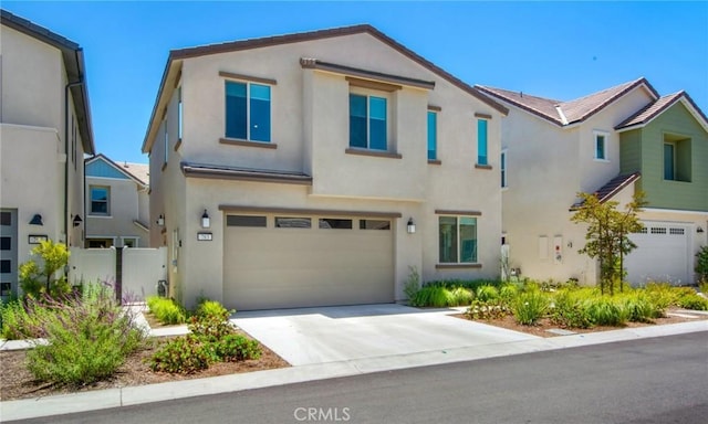 783 Longhorn, Rancho Mission Viejo, CA 92694 - view of front facade with stucco siding, a garage, and concrete driveway