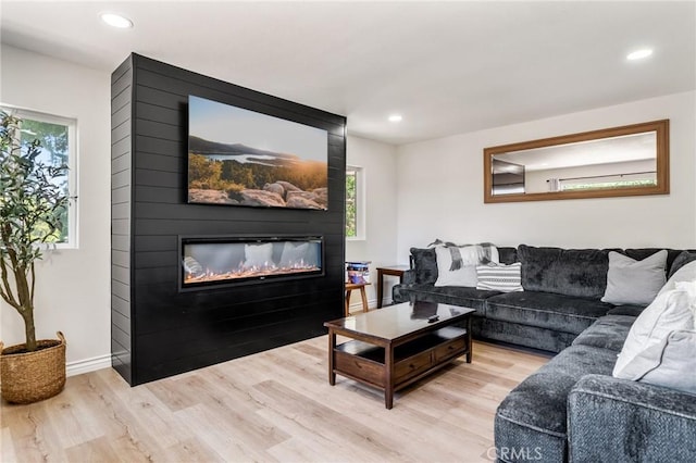 143 State Highway 173, Lake Arrowhead, CA 92352 - living area with a large fireplace, light wood-style floors, and recessed lighting