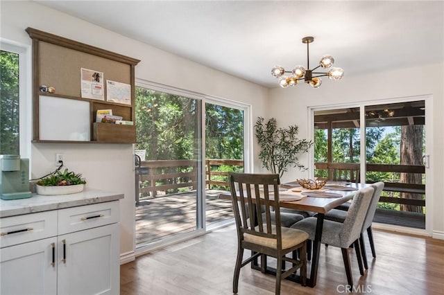 143 State Highway 173, Lake Arrowhead, CA 92352 - dining area with a chandelier and light wood finished floors