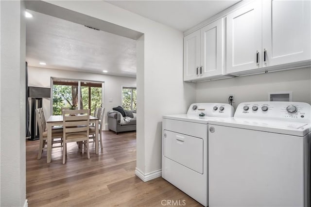 143 State Highway 173, Lake Arrowhead, CA 92352 - laundry area with cabinet space, washer and clothes dryer, light wood finished floors, and recessed lighting