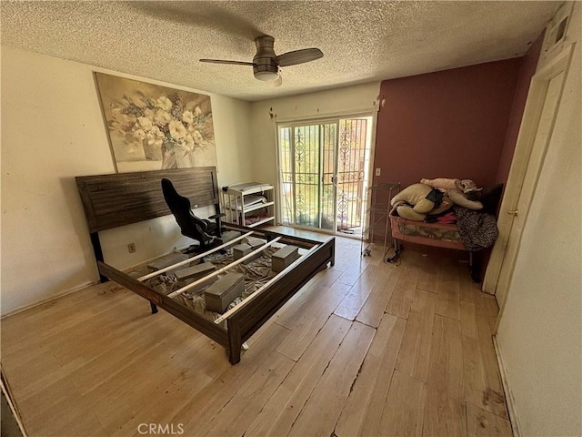 10164 Hampshire St, Rancho Cucamonga, CA 91730 - bedroom with hardwood / wood-style floors, a textured ceiling, and ceiling fan