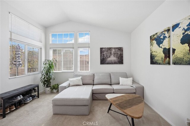 24461 Howes Dr, Laguna Niguel, CA 92677 - carpeted living room featuring lofted ceiling and baseboards
