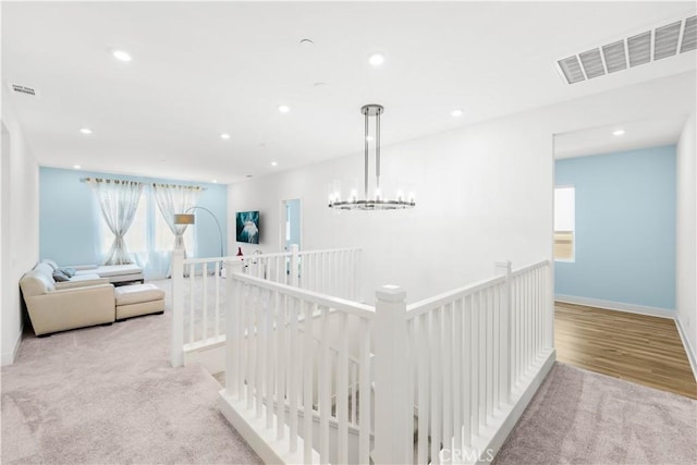 16526 Trailblazer Ave, Chino, CA 91708 - hall with an upstairs landing, healthy amount of natural light, recessed lighting, a chandelier, and wood finished floors
