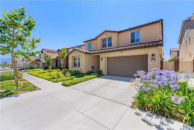 16526 Trailblazer Ave, Chino, CA 91708 - mediterranean / spanish house featuring stucco siding, a tile roof, concrete driveway, and a garage