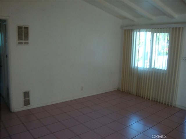 2100 W Dogwood Ave, Anaheim, CA 92801 - empty room featuring beamed ceiling and light tile patterned floors