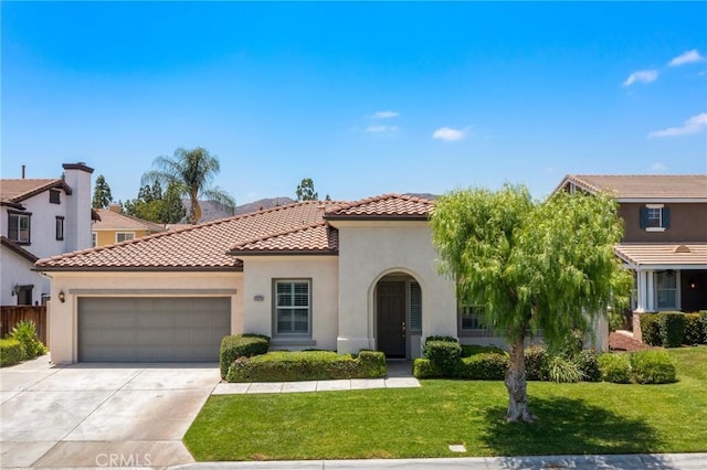 11529 Trailrun Ct, Riverside, CA 92505 - mediterranean / spanish home with a tiled roof, a garage, stucco siding, a front lawn, and driveway