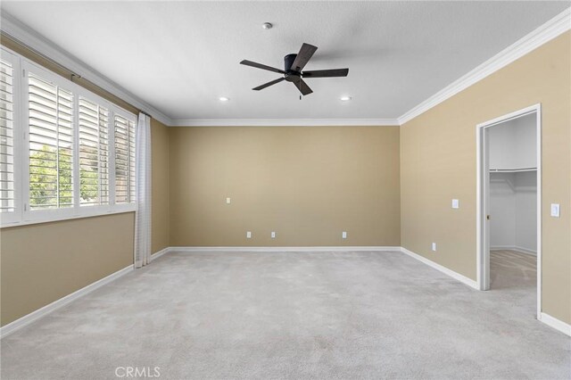 11529 Trailrun Ct, Riverside, CA 92505 - unfurnished bedroom featuring light colored carpet, crown molding, a spacious closet, recessed lighting, and ceiling fan