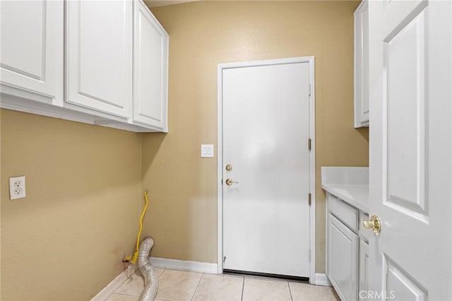 11529 Trailrun Ct, Riverside, CA 92505 - washroom featuring light tile patterned floors and cabinet space