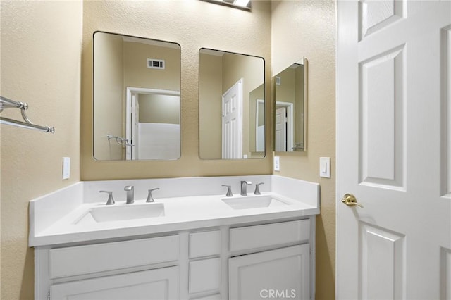 11529 Trailrun Ct, Riverside, CA 92505 - full bath with double vanity and a textured wall