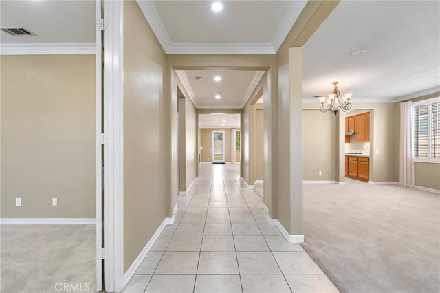 11529 Trailrun Ct, Riverside, CA 92505 - hall featuring ornamental molding, a chandelier, light carpet, recessed lighting, and light tile patterned floors
