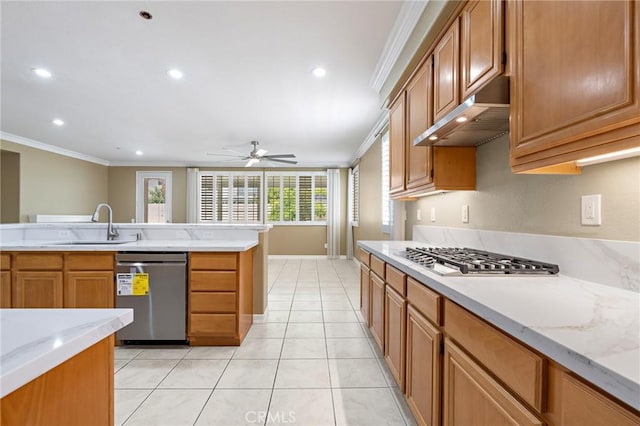 11529 Trailrun Ct, Riverside, CA 92505 - kitchen with appliances with stainless steel finishes, crown molding, under cabinet range hood, a ceiling fan, and brown cabinets