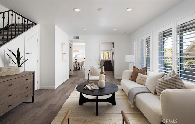 81 Golden Glen St Unit 1, Irvine, CA 92604 - living room with wood finished floors, recessed lighting, and stairs