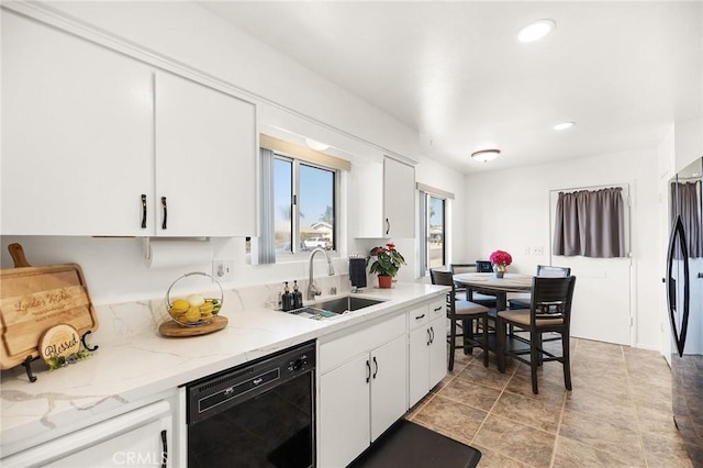 25890 Roanoke Rd, Menifee, CA 92586 - kitchen featuring black appliances, white cabinetry, recessed lighting, light stone counters, and light stone finish floors