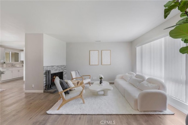 21237 Silver Cloud Dr, Diamond Bar, CA 91765 - living room with light wood-style floors and a fireplace