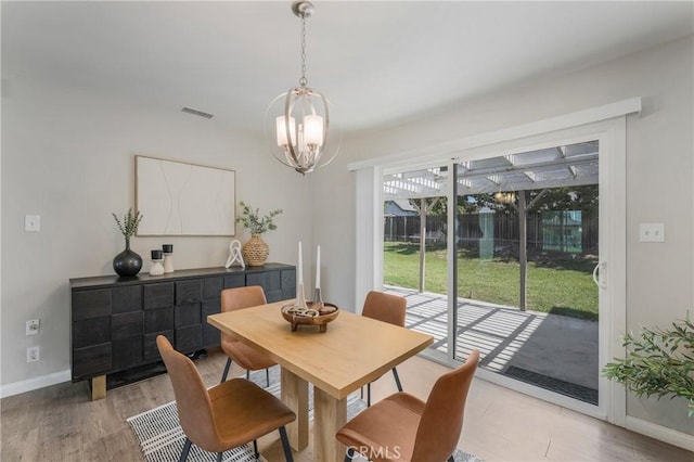 21237 Silver Cloud Dr, Diamond Bar, CA 91765 - dining area with a chandelier and light wood-style floors
