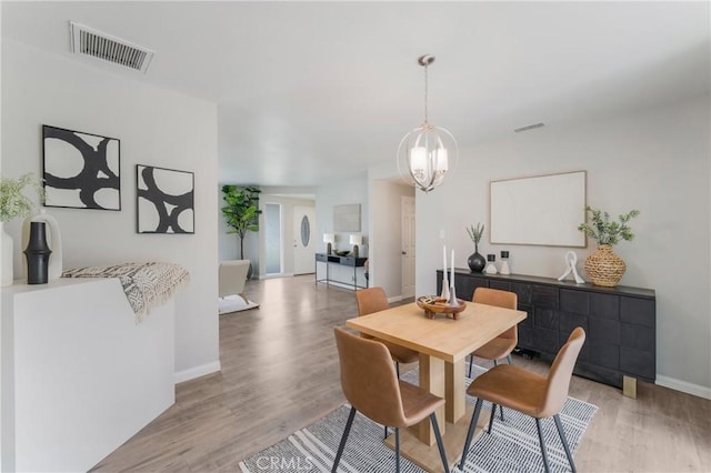 21237 Silver Cloud Dr, Diamond Bar, CA 91765 - dining space with a chandelier and light wood-style flooring
