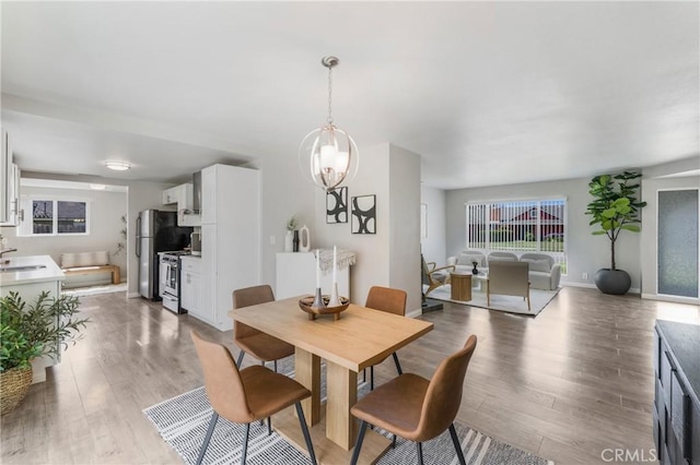 21237 Silver Cloud Dr, Diamond Bar, CA 91765 - dining area with light wood-style floors and baseboards