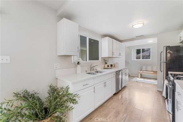 21237 Silver Cloud Dr, Diamond Bar, CA 91765 - kitchen with appliances with stainless steel finishes, light countertops, and white cabinets