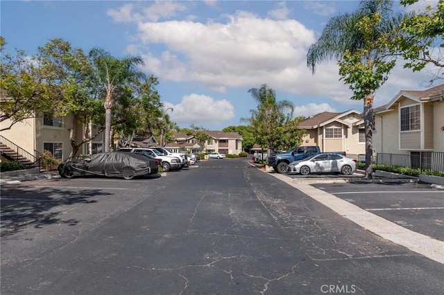 3555 Grove St Unit 231, Lemon Grove, CA 91945 - uncovered parking lot with a residential view and stairs