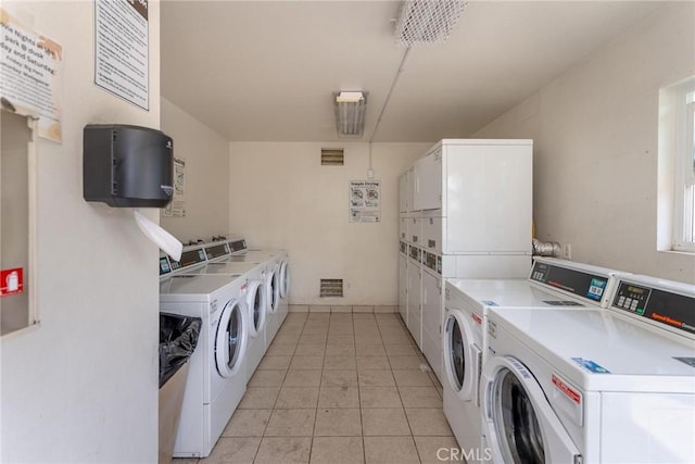 3555 Grove St Unit 231, Lemon Grove, CA 91945 - shared laundry room featuring stacked washer / dryer, washer and clothes dryer, and light tile patterned floors